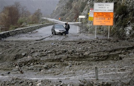 Mud blocks Big Tujunga Canyon Road in Los Angeles, Calif., last Tuesday. While the state saw heavy rains all last week, scientists hunkered down to work on a "Frankenstorm" scenario for the future.